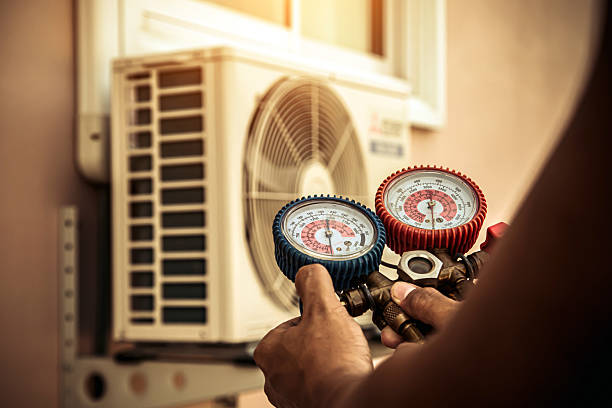 Professional Air Conditioning Service technician working in Waverly, MI